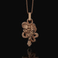 Load image into Gallery viewer, Silver Medusa Skull Pendant, Snake Necklace Design, Memento Mori Reminder, Symbol of Power & Mystery Rose Gold Finish
